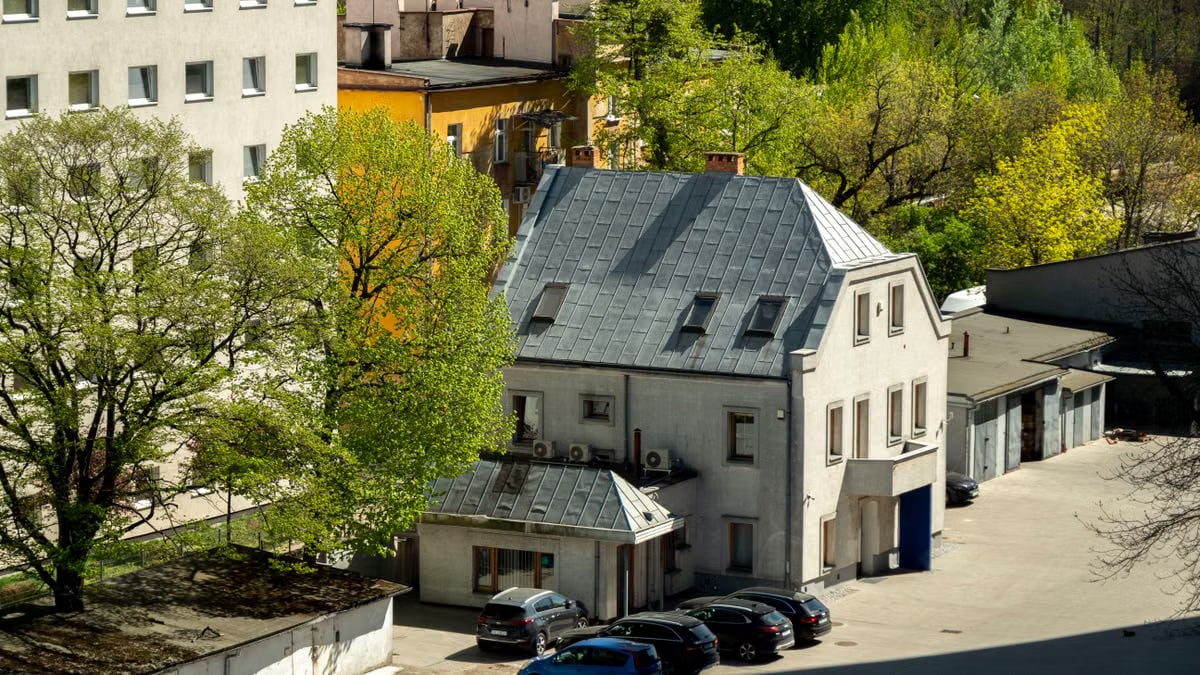 Aerial view of buildings and greenery in Wrocław, Poland, capturing an urban atmosphere in spring.